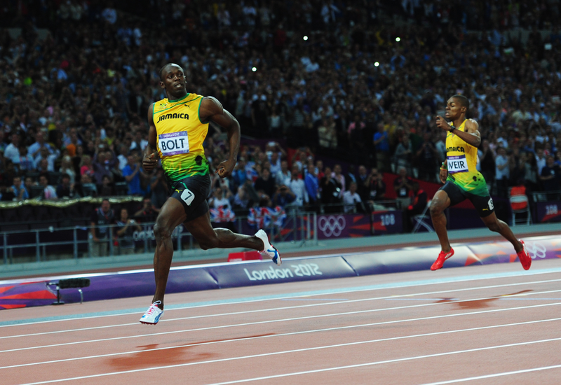 Illustration for article titled Photos Of Usain Bolt Looking Bored As He Blows Past The Best Runners In The World